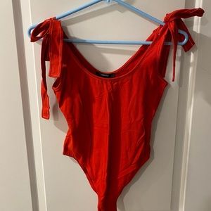 Red shoulder tie bodysuit